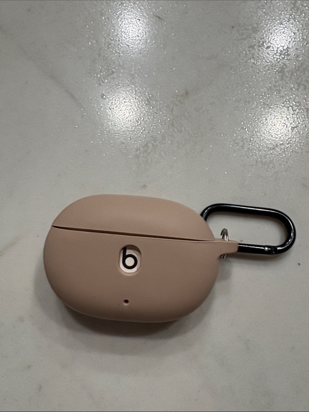Beats wireless earbuds with tan silicone case
